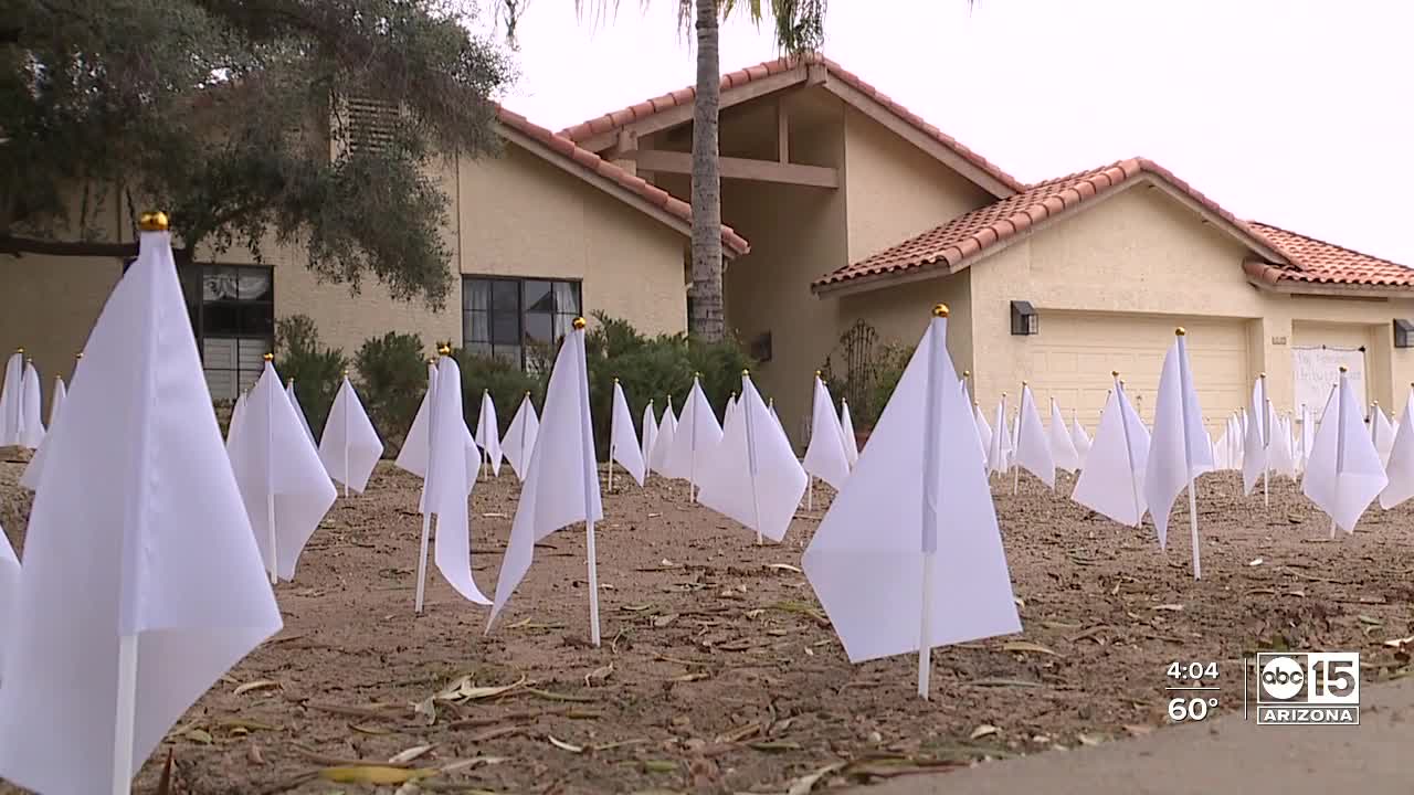 Tempe home displays white flags for those lost to COVID-19