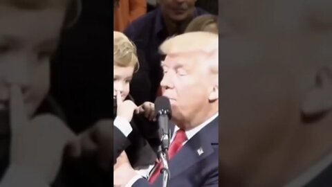 Kid speaks into mic 🎤 while on stage with President Trump