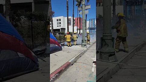 "Police and firefighters responded to a fire at a tent/makeshift shelter on Spring St.