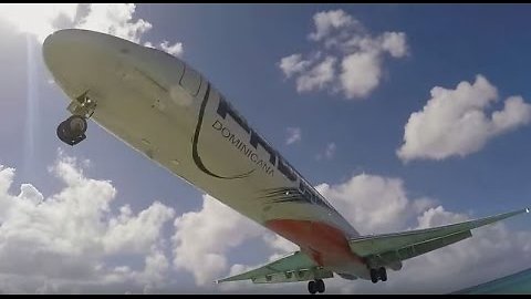 Plane Performs Scary Low Landing At St. Maarten Beach