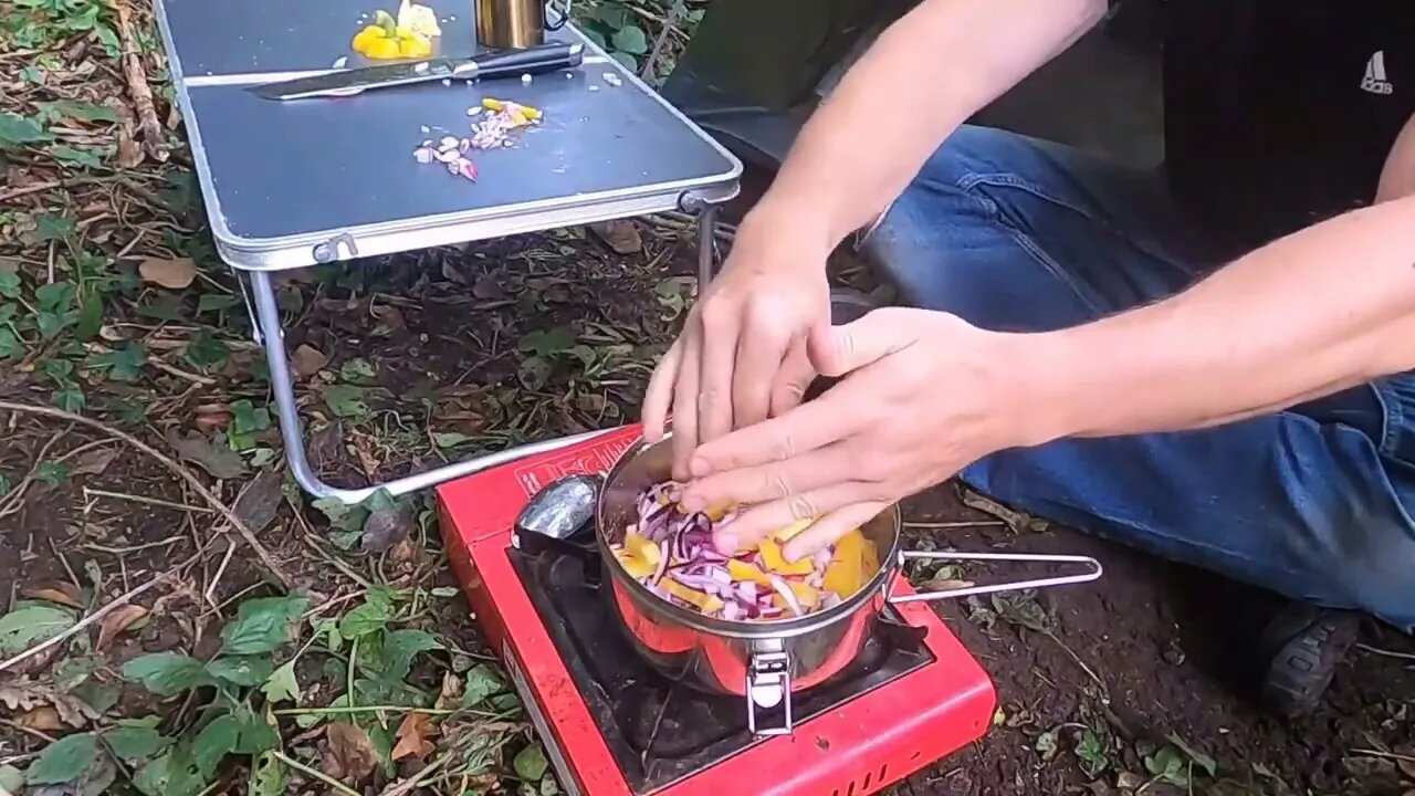 An abundance of camping food in the wilderness.19
