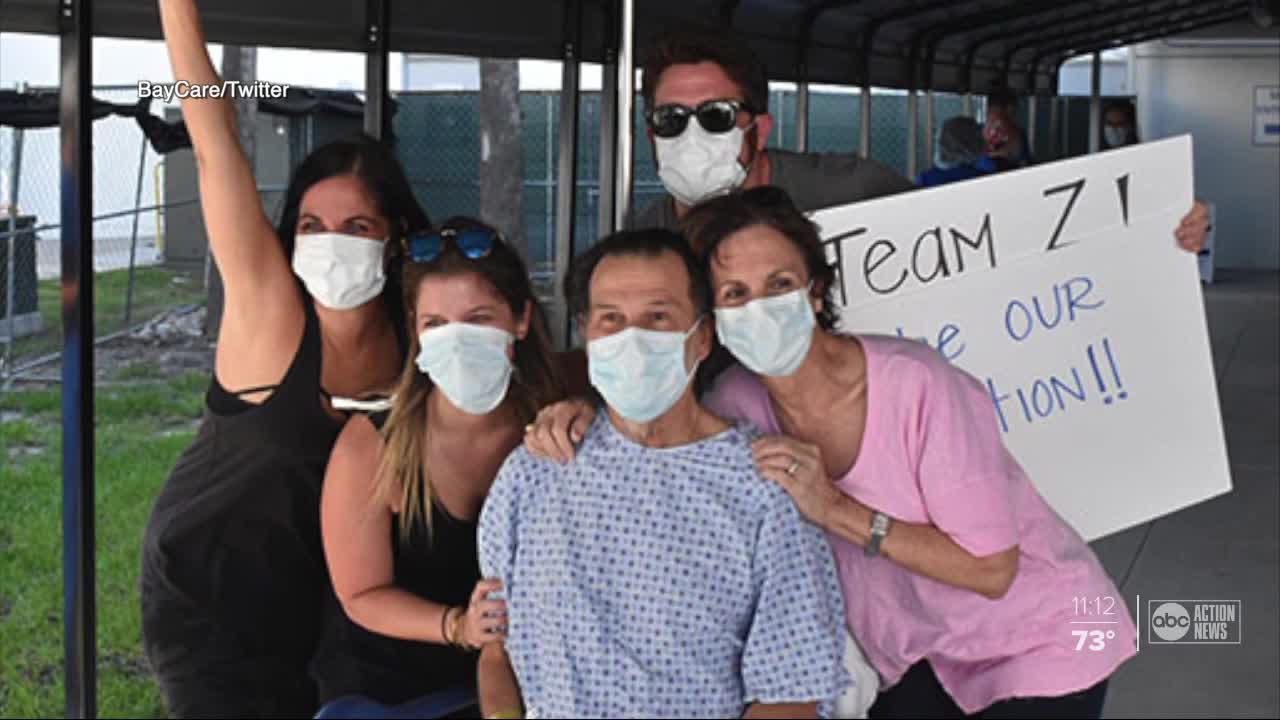 COVID-19 survivor leaves hospital to cheers and hugs