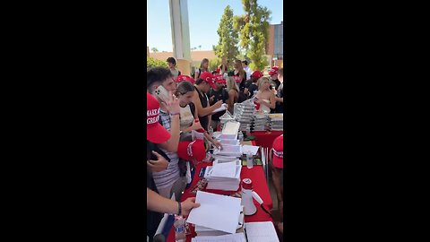 Students at ASU's "Greeks for Trump" event, handing out MAGA hats while pushing voter registration