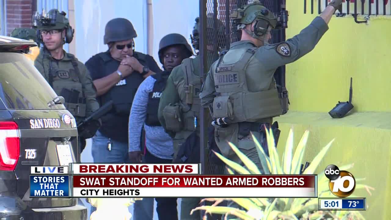 SWAT standoff for wanted armed robbers