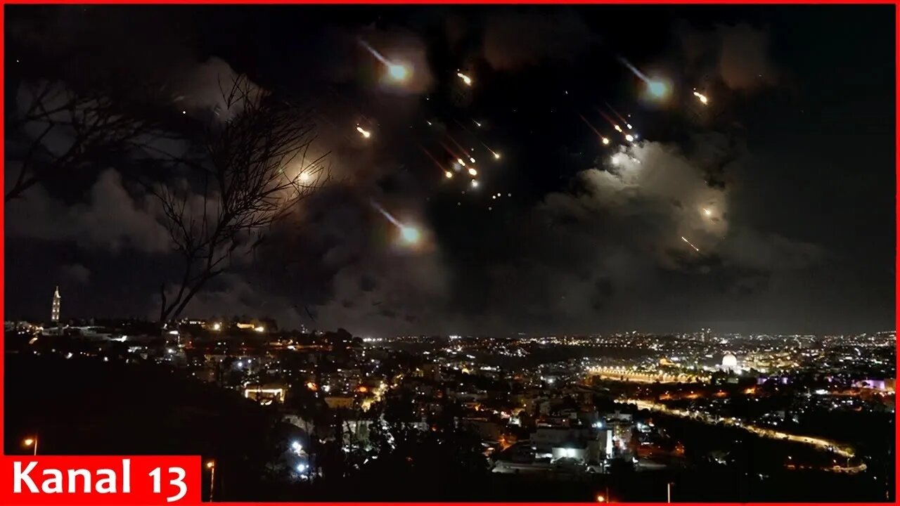 Missile strikes launched by Iran on Israel are visible over Jerusalem