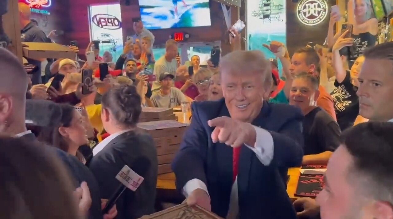 Trump Hands Out Free Pizza To An Excited Crowd