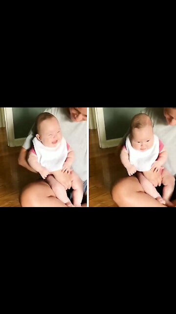 Funny Baby Laughing Out Loud Because of Puppy