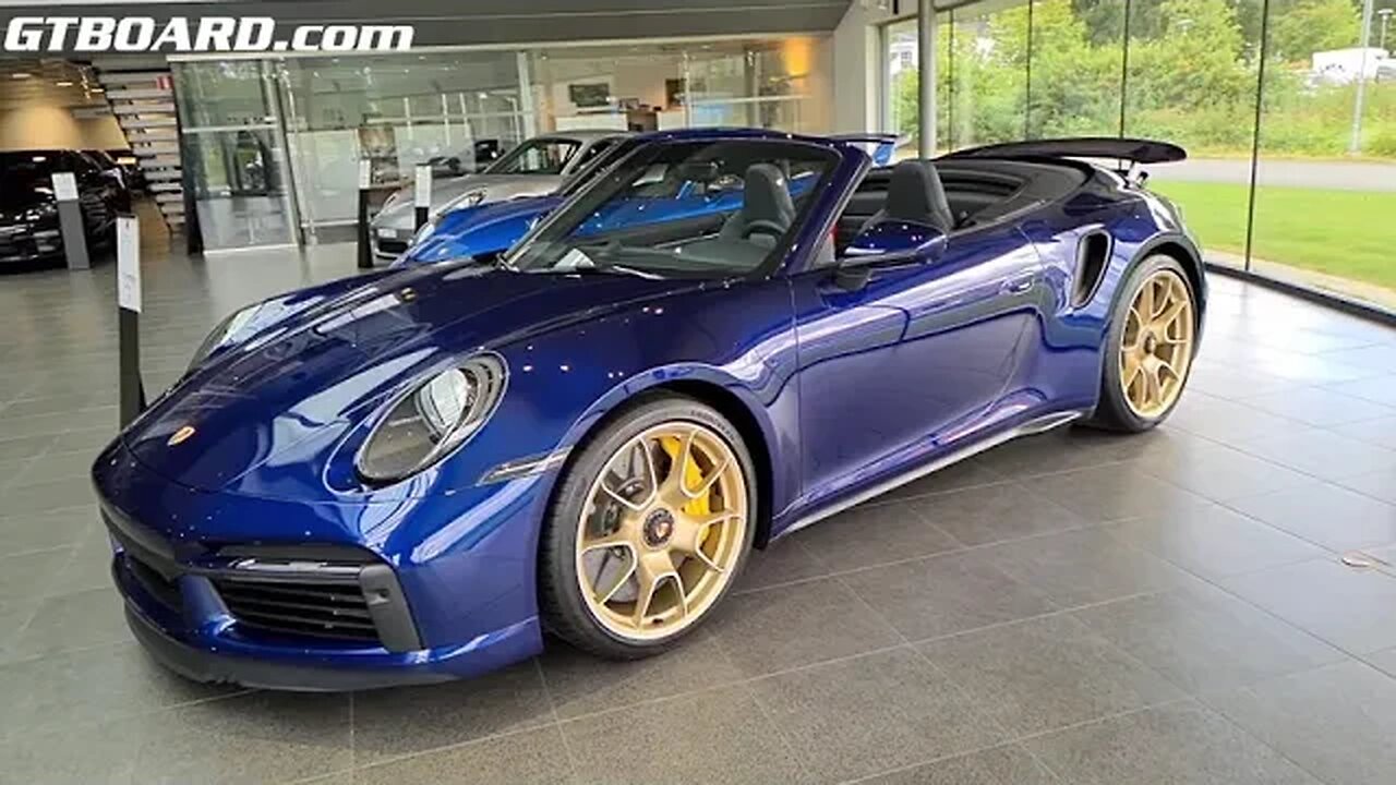 Slow motion Porsche 992 Turbo S Convertible Gentian Blue at Porsche Center Borås