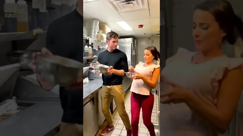 Happy Couple Dancing And Cooking