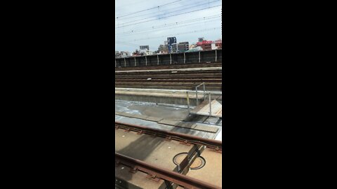 Bullet train in Japan leaving the station and coming up to full speed