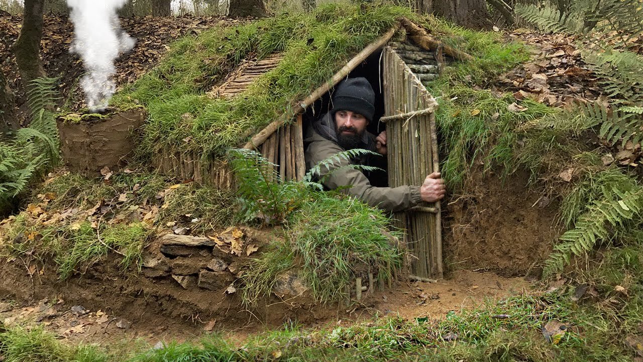 Building complete and warm survival shelter _ Bushcraft earth hut, grass roof & fireplace with clay