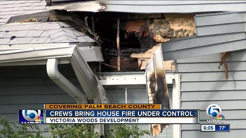 Crews bring house fire under control in Victoria Woods development