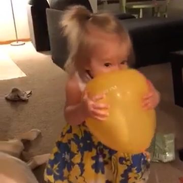 Little Girl Bites a Balloon and Begins To Cry When It Pops