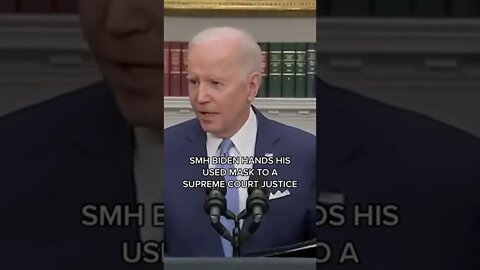 Biden hands his used mask to a Supreme Court Justice