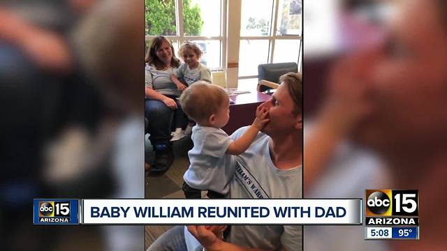 Baby William reunited with father