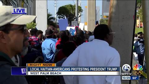 Haitian community gathers in Palm Beach County to protest President Trump