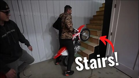 Big ken try's to ride a dirt bike up stairs!