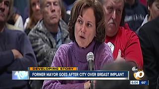 Former mayor sues city over breast implants