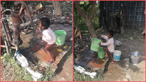 The child is having fun washing his feet and it is so much fun to watch