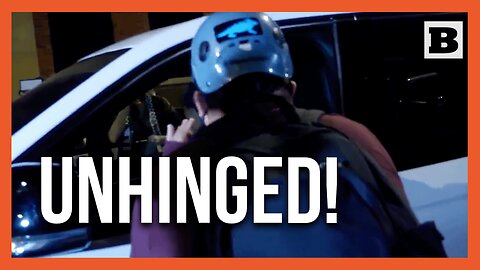 "The World Is Burning Alive!" Protester Freaks Out on Woman Trying to Drive Through Chicago