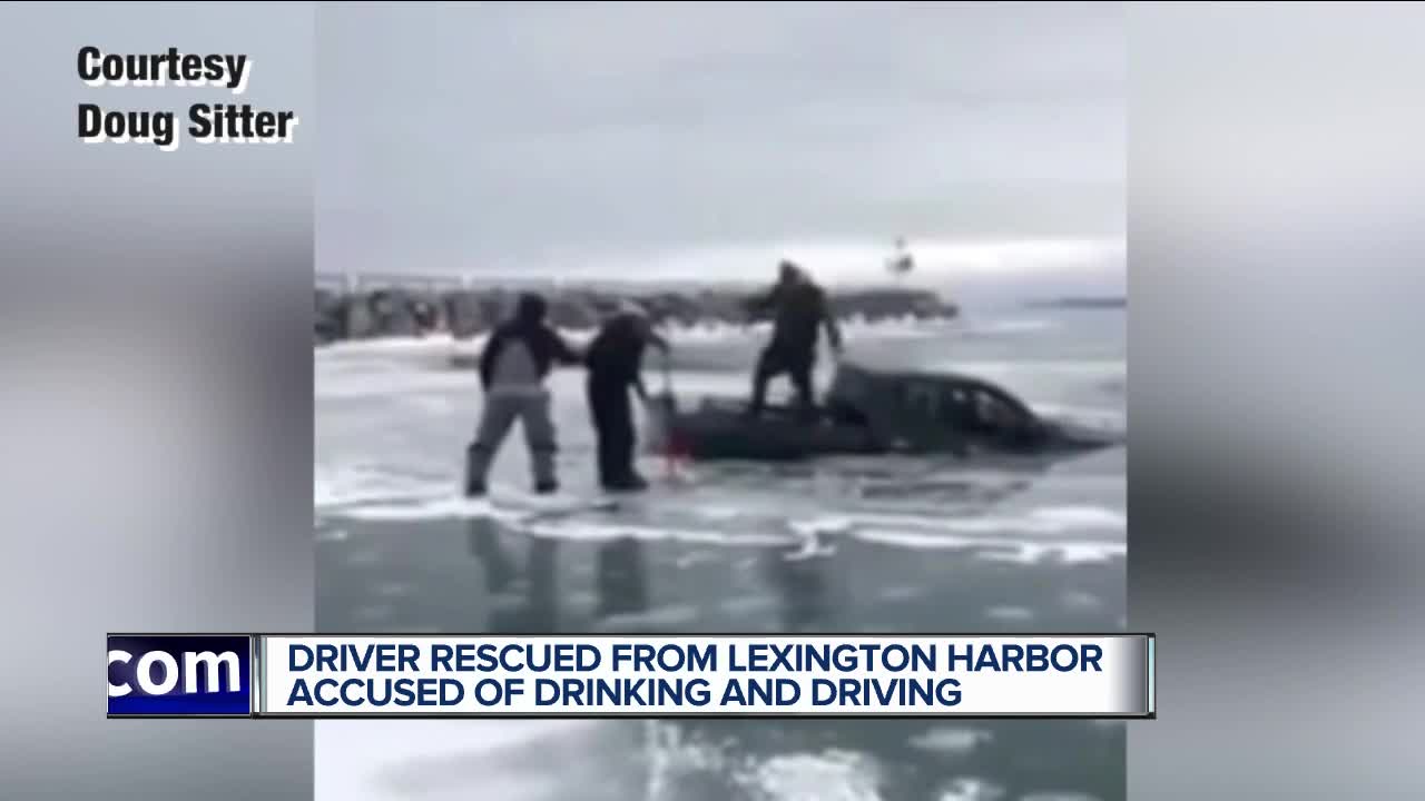 Man who rescued suspected drunk driver who crashed into lake says 'we knew he was going in'