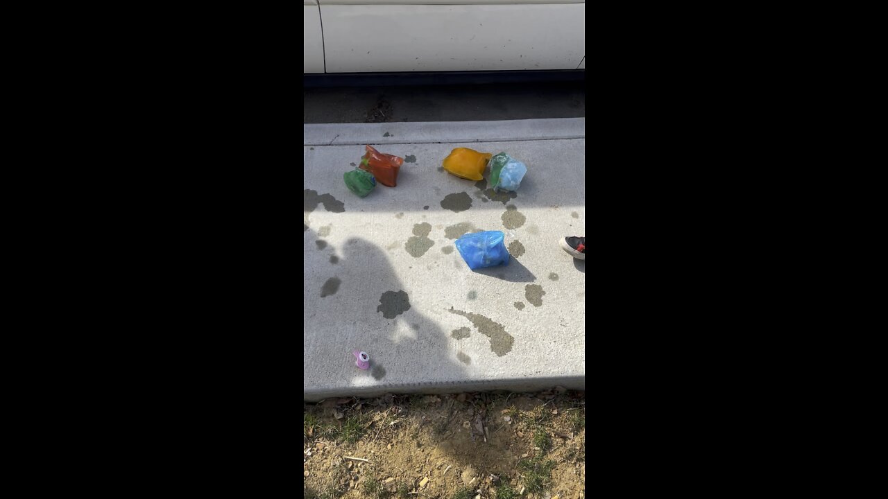 Smashing colored ice chunks with toys inside