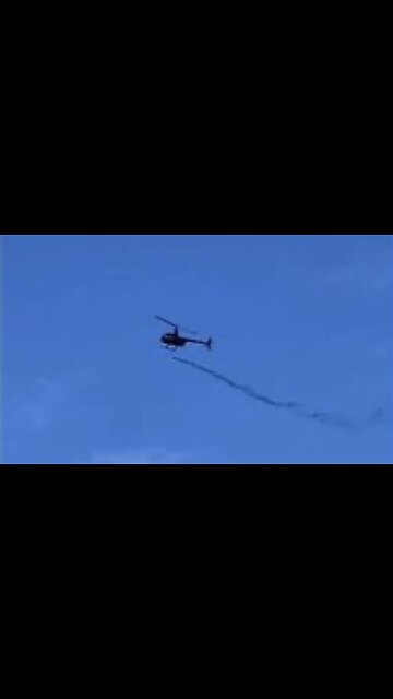 Helicopter dropping Bill Gates' mosquitoes