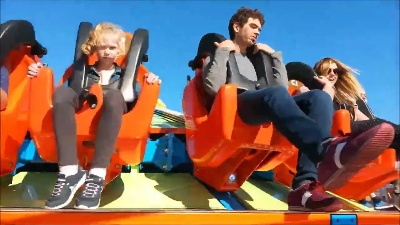 Having Fun On Amusement Park Ride