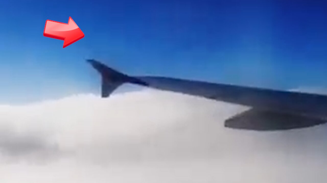 Black object passes by the aircraft as the aircraft enters the cloudy area [Space]