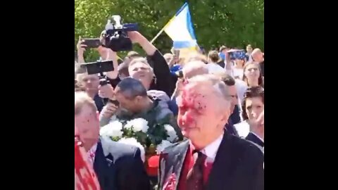 Russian ambassador to Poland doused with paint while laying flowers at cemetery of Soviet soldiers.