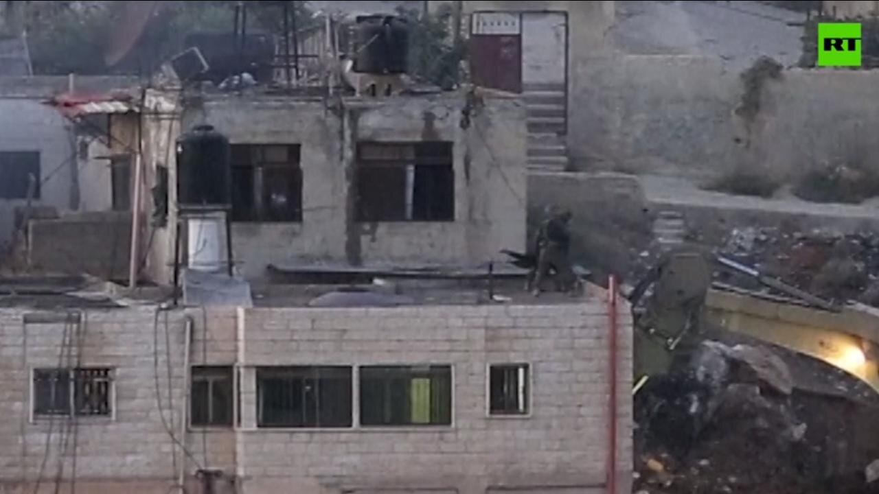 Israeli Soldiers Push Lifeless Bodies from West Bank Rooftop [Disturbing to me personally.]