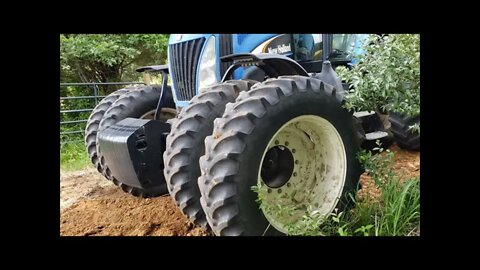 Massive New Holland TG255 tractor crossing my culvert pipe before it is finished!