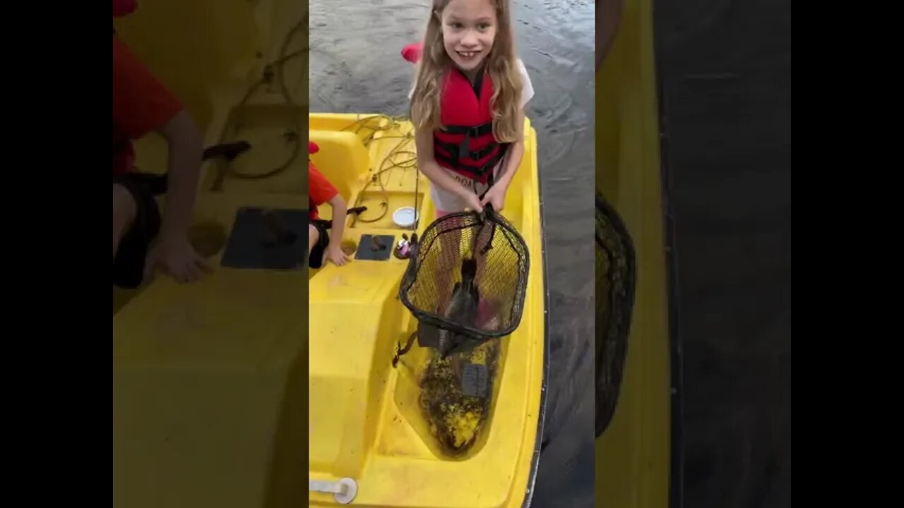 Annika reeling in a big one at the cottage