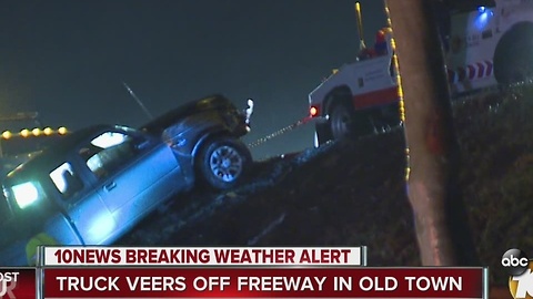 Truck veers off freeway in Old Town