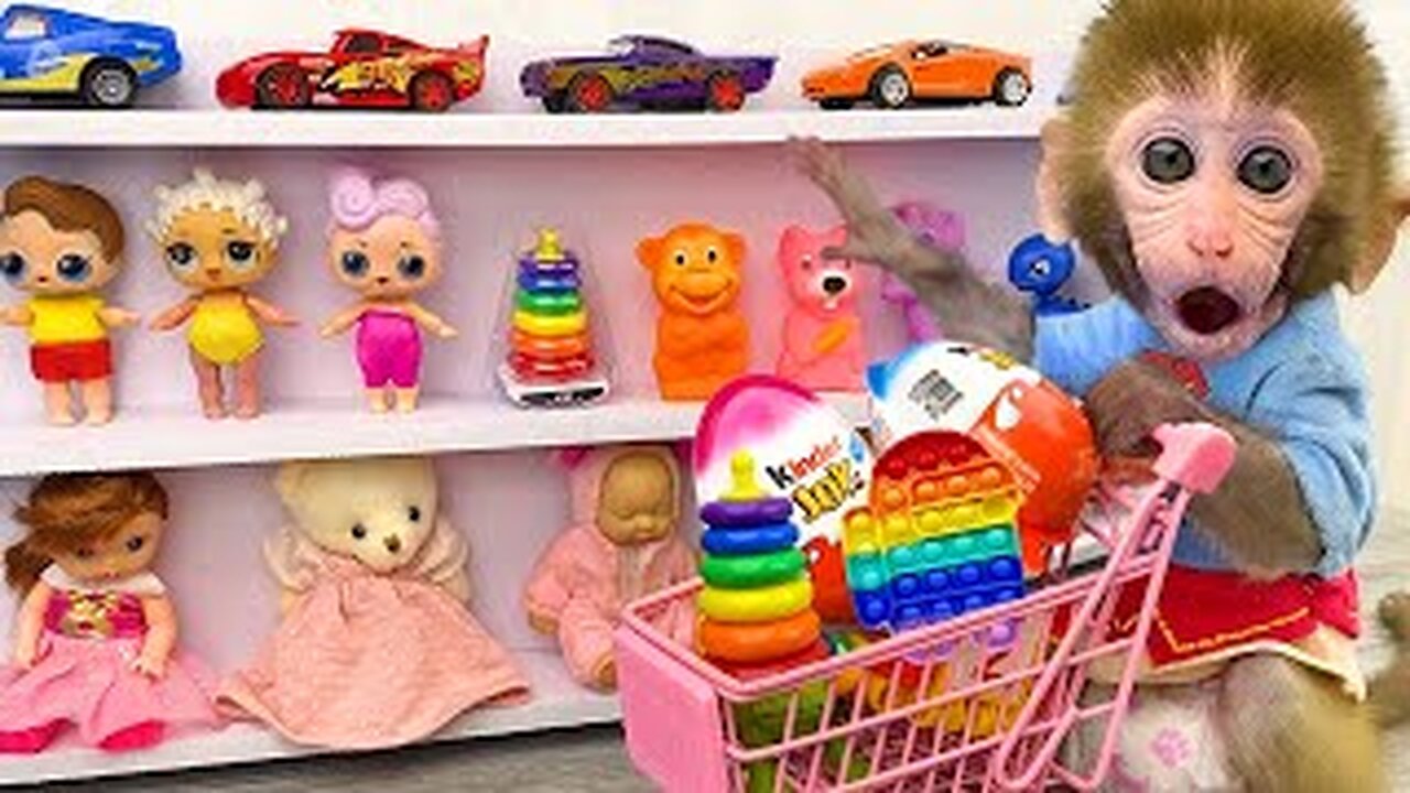 Baby Monkey Bon Bon doing shopping in Toy store and eat Kinder Joy Egg chocolate with puppy