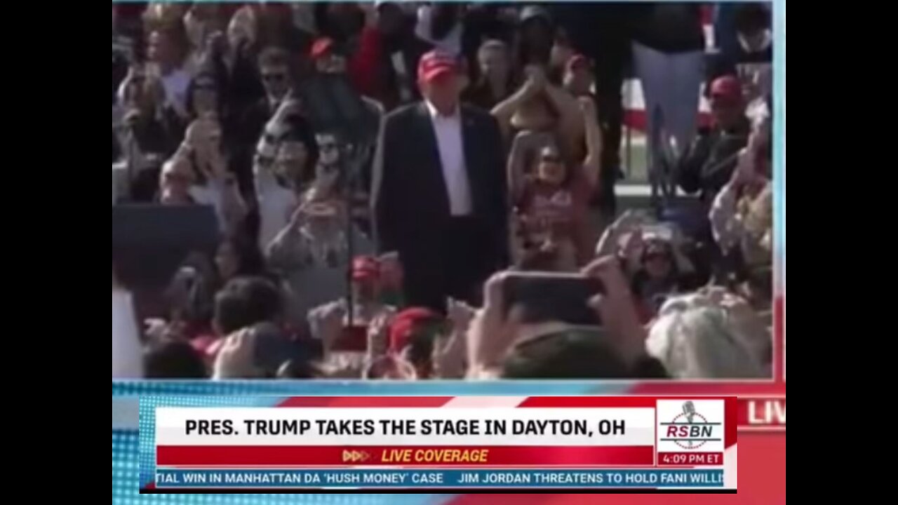 Trump salutes while playing an alternative national anthem at his rally, featuring violent January 6