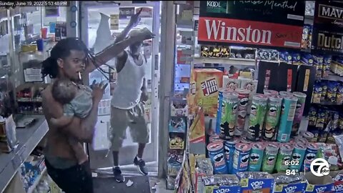 Dad holding his 7-month-old baby pushes away gunman who followed them into gas station