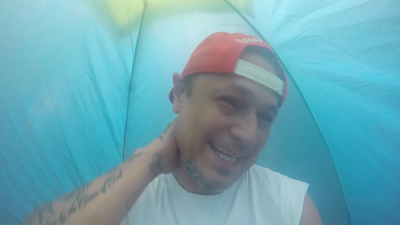 Trying to stay dry in a old cheap tent!