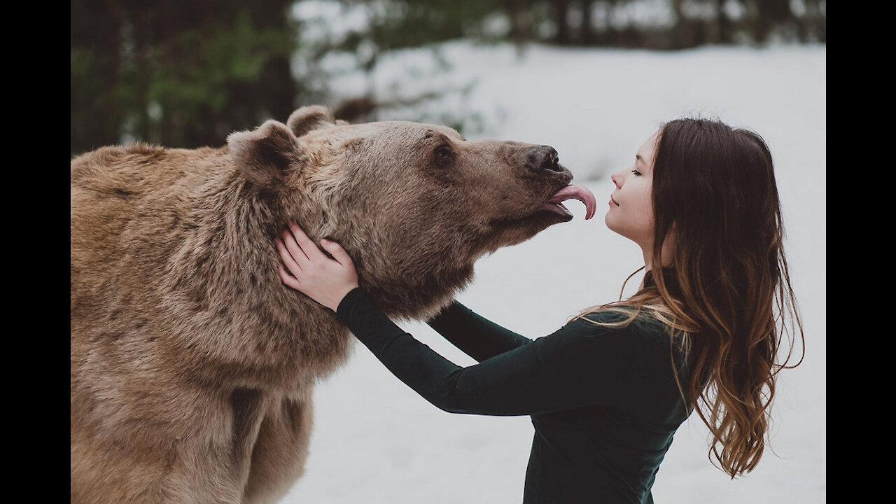 Shocking video from Russia. Wild bear playing with a man