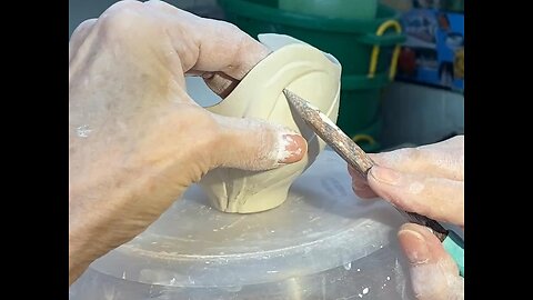 Carving a porcelain bowl.