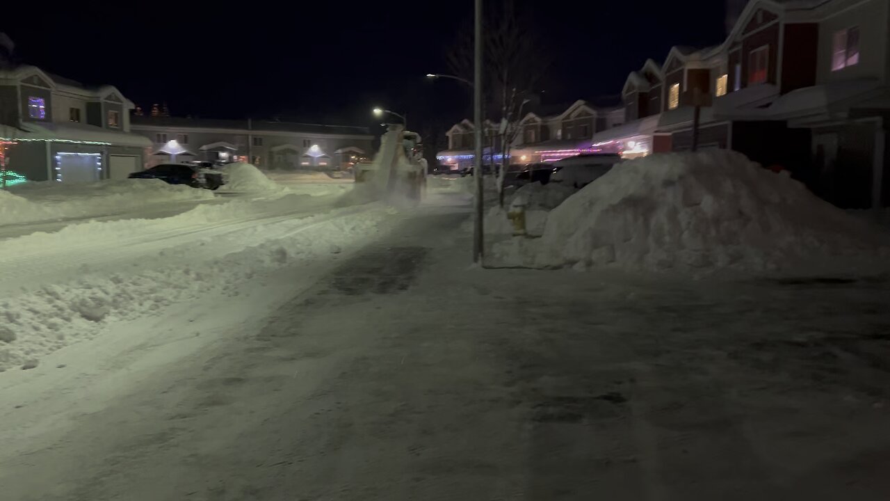 JBER Alaska, street cleaning building a snow fort.