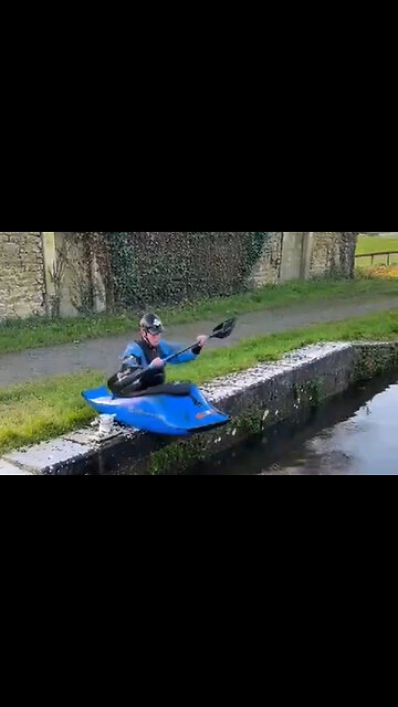 Kayaker Flips Across Canal!