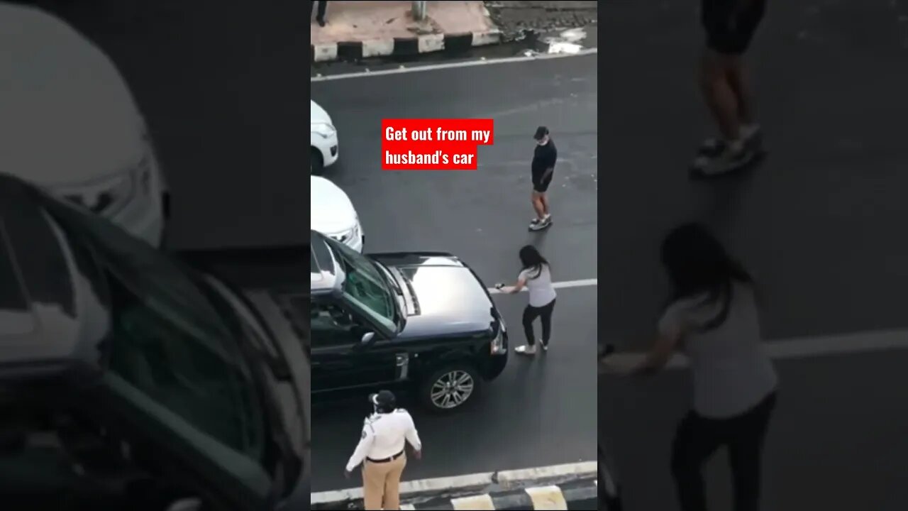 An enraged wife brought traffic to a standstill she spotted her man in the car with another woman