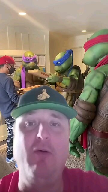 Pizza dude delivers to the ninja turtles.