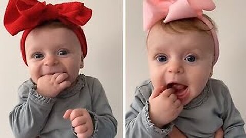 Adorable baby girl shows off her bow collection