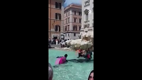 Climate activists in Rome turned the legendary Trevi Fountain waters black