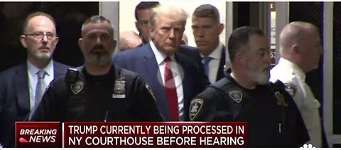 Donald Trump enters New York City courtroom following arrest processing