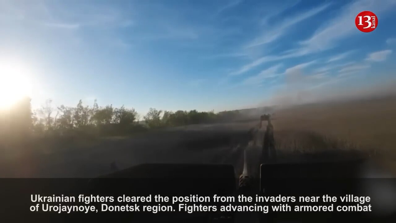 Advancing with military hardware, Ukrainian soldiers fire continuously at Russians in the forest