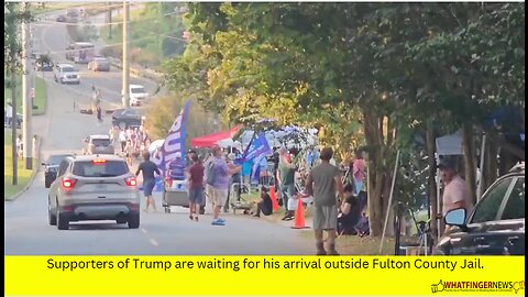 Supporters of Trump are waiting for his arrival outside Fulton County Jail.