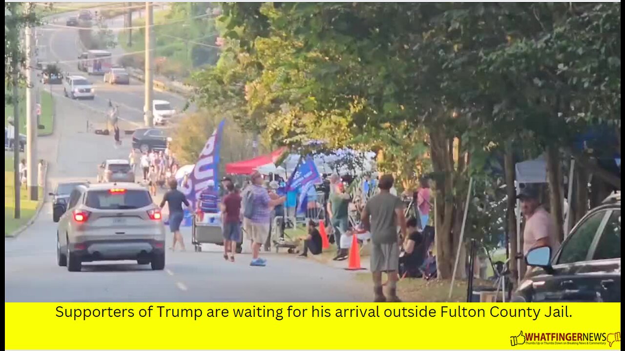 Supporters of Trump are waiting for his arrival outside Fulton County Jail.